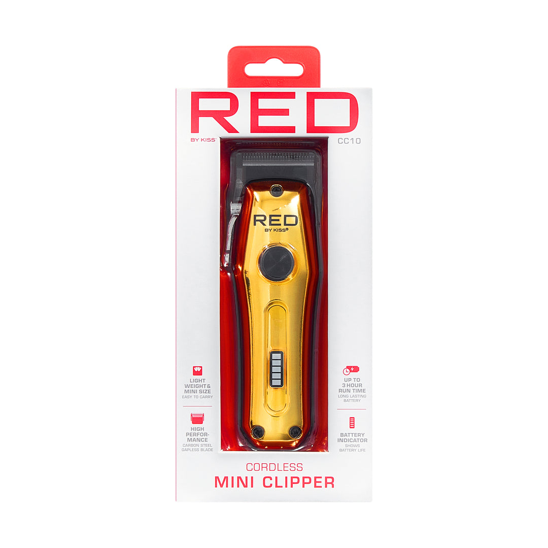 CC10_main "A product packaging for a cordless mini clipper branded as "RED" by KISS. The clipper is prominently displayed in a sleek design with a shiny gold finish. The packaging includes a clear window showcasing the clipper, along with a red and white 