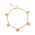 JA111_main "A packaging for a 14kt gold-plated anklet from the brand "Arria by Kiss." The anklet is adorned with butterfly charms and small decorative stones. The packaging is predominantly white with gold lettering, displaying the product name and price 