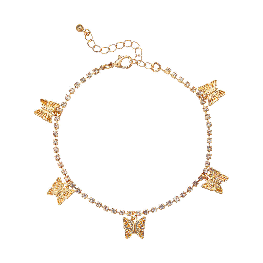 JA111_main "A packaging for a 14kt gold-plated anklet from the brand "Arria by Kiss." The anklet is adorned with butterfly charms and small decorative stones. The packaging is predominantly white with gold lettering, displaying the product name and price 
