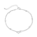 JA202_main "A delicate silver bracelet composed of multiple strands. The design includes small oval links and bead-like elements, creating a layered effect. At the center, there is a heart-shaped charm that adds a charming focal point. The bracelet is fin