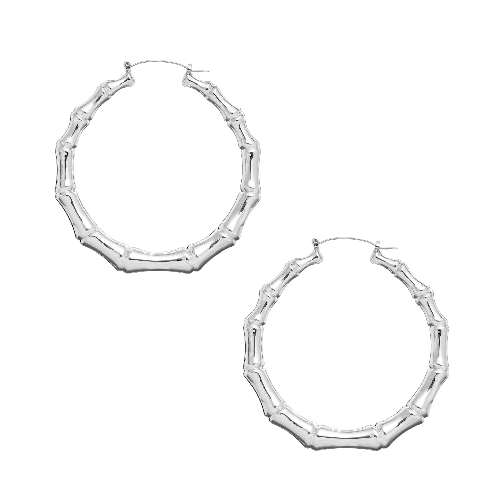 JE411_main "A pair of silver hoop earrings designed to resemble bamboo. The earrings have a textured surface with a shiny finish, giving them a modern and stylish look. One earring is shown from the front, while the other is displayed from the side, highl