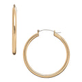 JE516_main "A pair of gold hoop earrings. The earrings are circular in shape and have a smooth, polished finish. One earring is shown from the side, highlighting its thin profile, while the other is displayed from the front, showcasing its full circular f