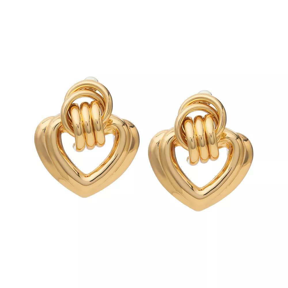 JE723_main "A pair of gold-tone heart-shaped earrings displayed on a white card. The earrings have a layered design, with a larger outer heart shape and a smaller inner heart, both connected by a series of three rings at the top. The card is labeled "arri