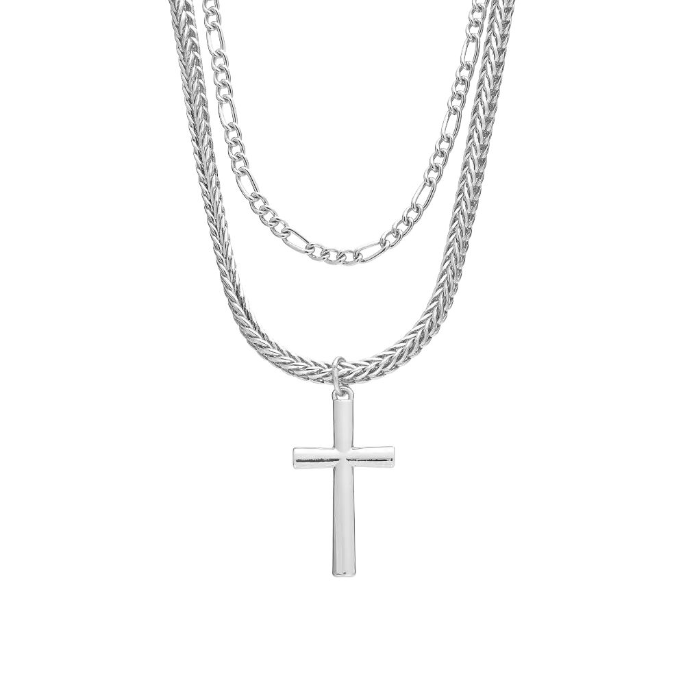 JN227_main "A silver necklace composed of two chains layered together. The top chain is a simple, smooth design, while the bottom chain has a twisted or braided appearance. Hanging from the lower chain is a polished silver cross pendant, which adds a reli