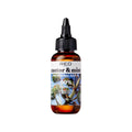 NHL14_main "A small amber-colored bottle with a black dropper cap. The label on the bottle reads "RED castor & mint PROFESSIONAL HAIR OIL" and indicates that it is "99% NATURAL." The label also features an image of castor plant leaves and mint leaves. The