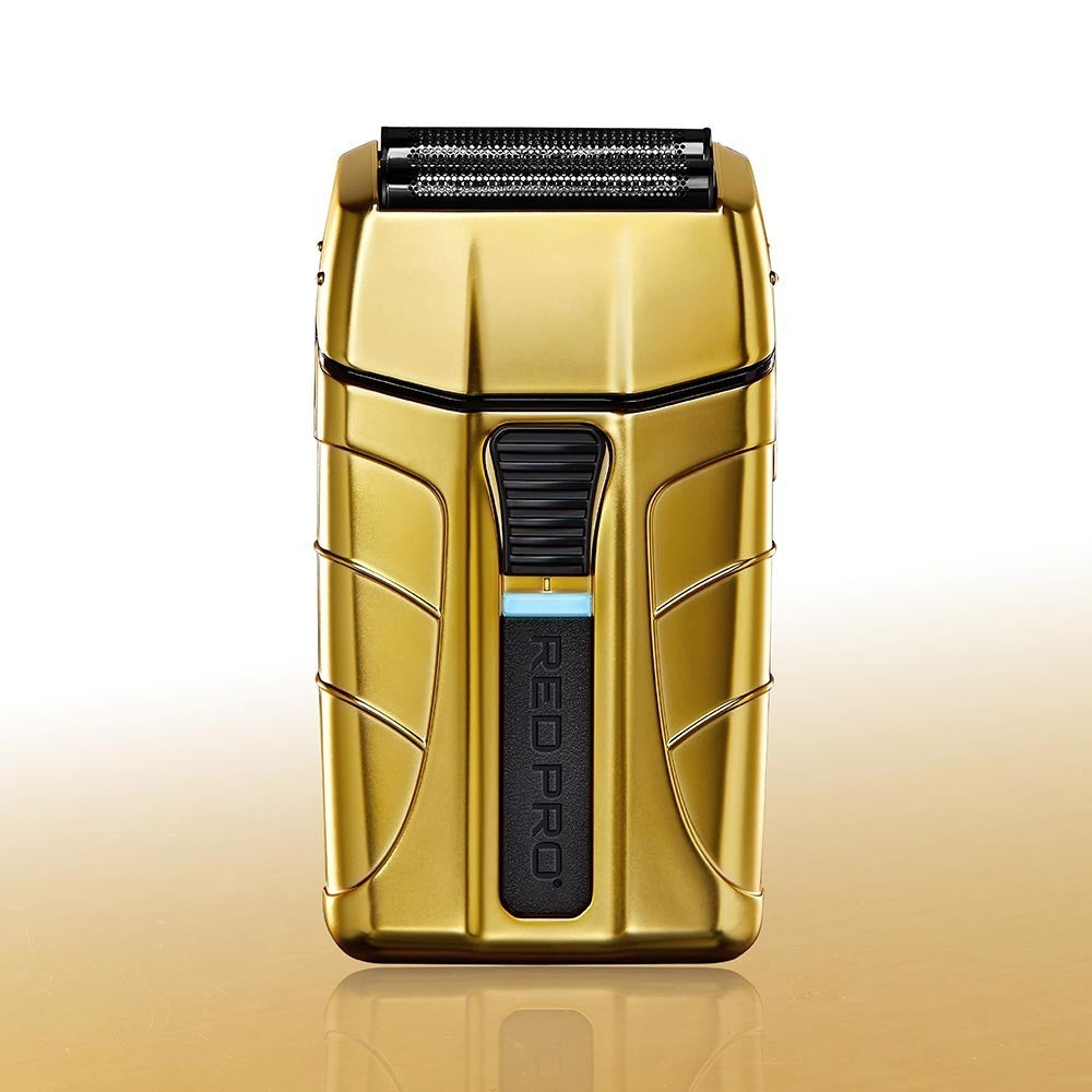 PSV01_main "The packaging of a product called "RED PRO" with the model number "PSVD1." The product is a cordless shaver, prominently displayed in the center of the packaging. The shaver has a sleek, gold-colored design with the brand name "RED PRO" visibl