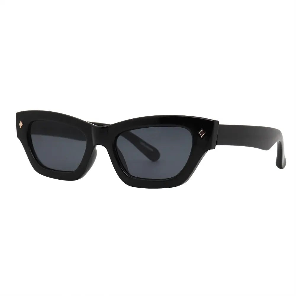 SUN12V5_main "A pair of stylish sunglasses with a bold, angular design. The frames are predominantly black and have a distinctive cat-eye shape, giving them a fashionable and edgy look. The lenses are dark, providing a sleek appearance, and there are smal