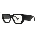 SUN41V5_main "A pair of stylish eyeglasses with a bold, geometric design. The frames are predominantly black and have a unique, angular shape that gives them a modern and edgy look. The lenses are clear, suggesting they may be non-prescription or for fash