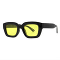 SUN52V5_main "A pair of stylish sunglasses with a bold, modern design. The frames are black and have a chunky, rectangular shape, giving them a contemporary look. The lenses are a vibrant yellow, adding a pop of color and a unique flair to the overall aes
