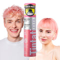 TCS21_main "A display box containing multiple cans of "Tintation Color Spray" by RED by Kiss. The cans are pink and labeled with the color "Pink Petal" (TCS21). The label also mentions that the spray is a temporary hair color. The cans feature a pointed n