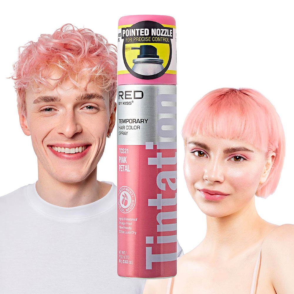 TCS21_main "A display box containing multiple cans of "Tintation Color Spray" by RED by Kiss. The cans are pink and labeled with the color "Pink Petal" (TCS21). The label also mentions that the spray is a temporary hair color. The cans feature a pointed n